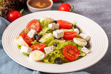 Colorful vegetables with quail eggs and cheese on a plate. Healthy food concept. Lifestyle