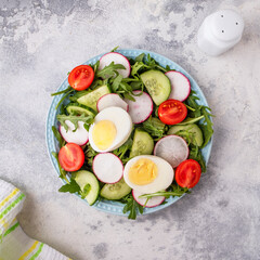 Top view of vegetables salad on a plate. Healthy  food concept.