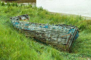 Old wrecked rowing boat.