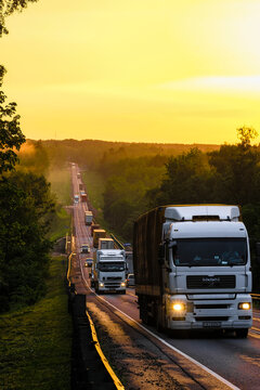 Moscow region, Russia - June, 11, 2020: image of a country highway at sunset