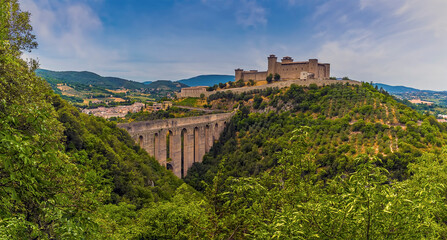 The Tower Bridge spans the gorge leading to the hill top fortress in Spoleto, Italy in summer