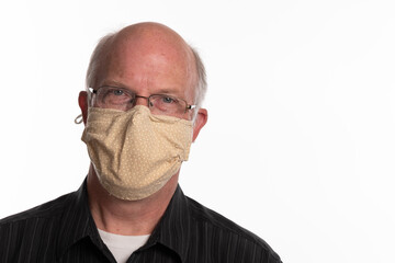 Headshot of male teacher wearing Covid 19 mask isolated on white background with room for copy to the right