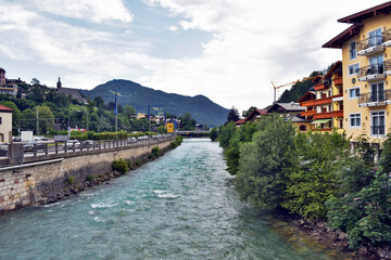 Fototapeta na wymiar Mountain river in the Bavarian village near the Royal lake.European tourism and travel.