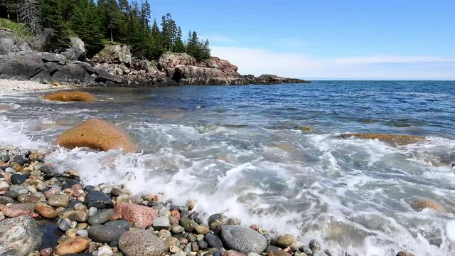 Waves crashing on the rocks of the coastline in Acadia National Park in Maine video clip in 4k