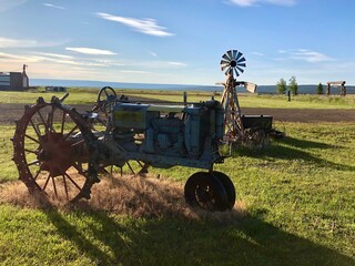 Windmill and a tractor up close