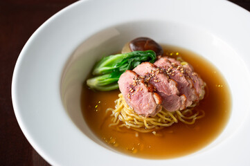 sliced roasted duck and simmered baby bok choy and shiitake mushroom ramen noodle soup