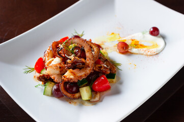 grilled octopus legs with diced zucchini, tomato, grape, diill and sour cream 