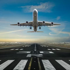 Zelfklevend Fotobehang Airplane taking off from the airport runway, front view © Lukas Gojda