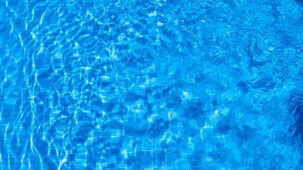 Naklejka na ściany i meble water ripples in a swimming pool in summer
