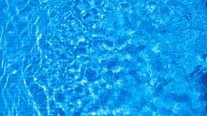 water ripples in a swimming pool in summer