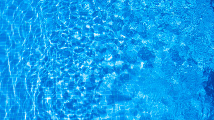 water ripples in a swimming pool in summer