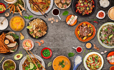 Asian food background with various ingredients on rustic stone background , top view. Vietnam or Thai cuisine.