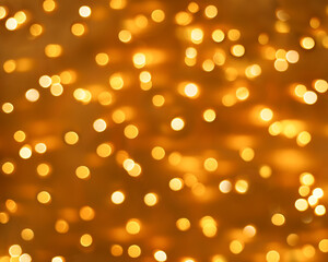 Abstract yellow blurred, shiny background. Bright confetti glitter. Festive Christmas defocused background.