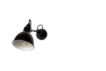 Close up isolated view of single Black and modern wall lamp on white wall
