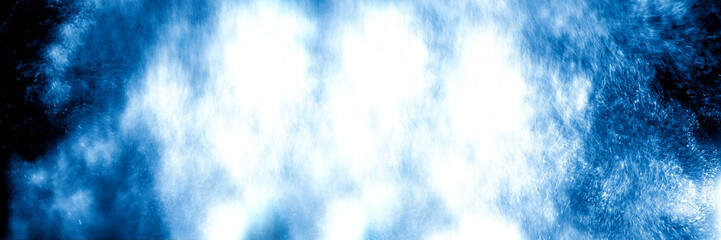 Giant and furious water wave splash on black background. Abstract background concept.