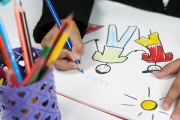 Family therapy. Schoolboy drawing family. Painting with colored marker. Drawing class. Homeschooling during covid-19. Back to school