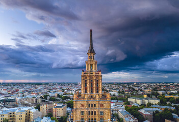 Fototapeta na wymiar Aerial view of iconic Riga city in dramatic sunset. Modern architecture in Europe with storm clouds
