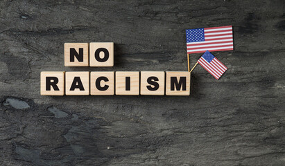 wooden cubes with no racism words