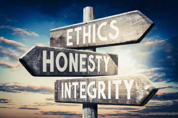 Ethics, honesty, integrity - wooden signpost, roadsign with three arrows
