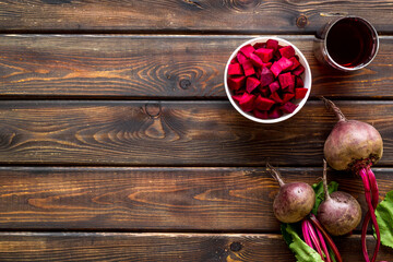Top view of beet harvest. Green tops, slices, juice top-down space for text
