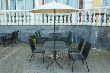 Empty tables in a summer cafe