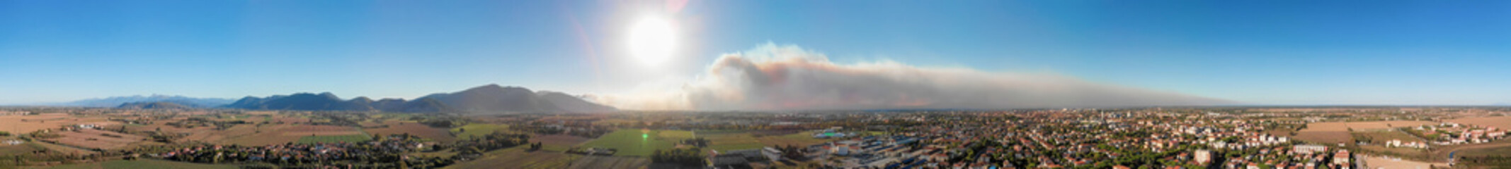 Aerial view of countryside with Arson. Smoke towards the sky, view from drone