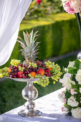 Various fruit servings on a silver tray for a wedding ceremony