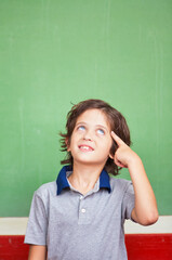 Elementary school scene. Caucasian boy having a great intuition
