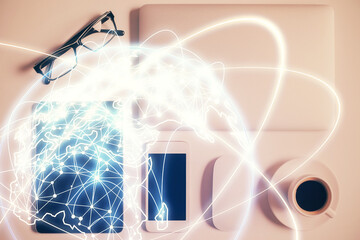 Double exposure of business theme hologram over desktop with phone. Top view. Mobile international trade connection concept.