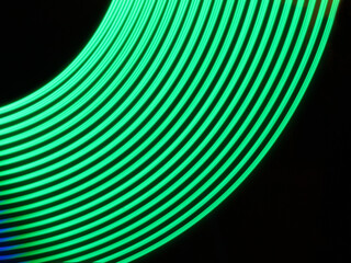 Rounded green LED lamp track. Neon light lamp on long exposure shot.