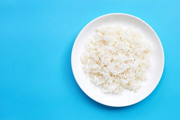 Dish of rice on blue background.