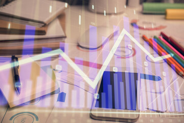 Double exposure of forex chart drawing and cell phone background. Concept of financial data analysis