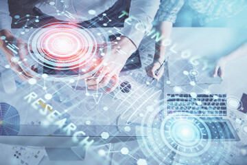 Double exposure of man and woman working together and data theme hologram drawing. Computer background. Top View.