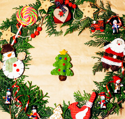 handmade christmas ornament rounded in mess with toys, candles, fir, ribbon wooden paper vintage