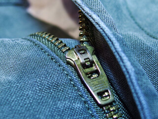 Closeup of zipper on denim jeans