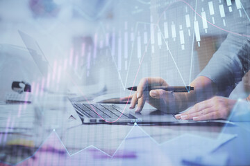 Multi exposure of woman hands typing on computer and financial chart hologram drawing. Stock market analysis concept.