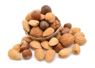 Mixed nuts selection of Brazil,almonds,waln ut and hazelnuts in basket on white