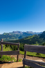 Fototapeta na wymiar meadow woth wooden fence in the dolomite alps, south tyrol, italy