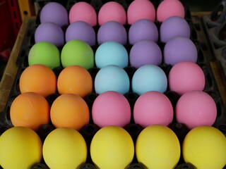 colourful eggs for sale on the market.