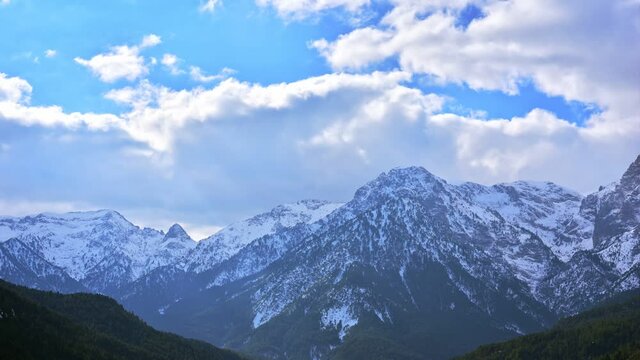 Aroania covered by snow in winter. Rolling clouds on the top of Chelmos mountain in Achaea, Greece. Time-lapse. Static shot