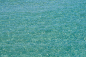 Tropical vacation paradise with white sandy beaches. Lagoon and white sandy beach. Sea texture or pattern, summer background.