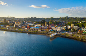 Fototapeta na wymiar aerial view from the bay to the downtown of the city of Puerto Montt. you can see the square and its pier