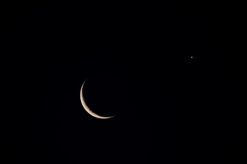Zoom shot of the moon in conjunction with the planet Venus. astronomical event