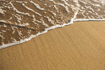 Wave of the ocean tropical beach sand.