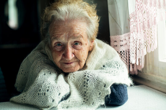 Portrait of an elderly beautiful wrinkled woman.