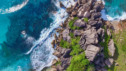 Amazing aerial view of Grand Anse in La Digue Island, Seychelles. Ocean and forest