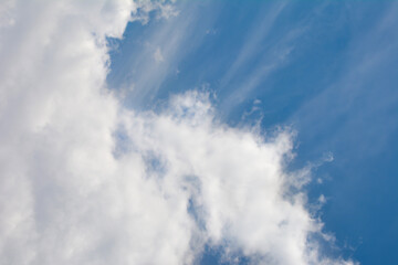 Snow-white clouds against a blue sky