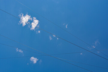 Fototapeta premium Snow-white clouds against a blue sky