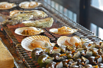 Grilled scallops and shellfish in a famous japanese restaurant in Otaru