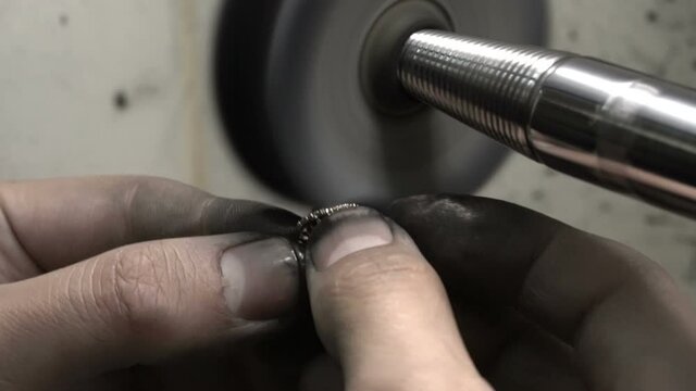 polishing diamond solitaire ring jeweler master. Craftsman hand made diamond ring product. closu up macro shooting